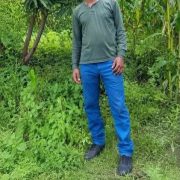Lamma werku standing on his farmland
